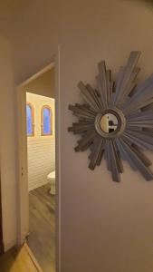 a clock on the wall of a bathroom at chez steph in La Trinité +12 photos