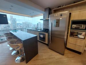 Kuchyň nebo kuchyňský kout v ubytování Book Santos - Unlimited 1608 Panorâmico c/ 3 dorm