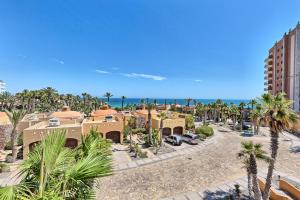 an aerial view of a resort with palm trees at Bella Sirena Condo 201-E - Elegant Condo with Sunrise Sea Views in Puerto Peñasco