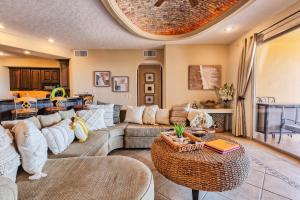 a living room with a couch and a table at Bella Sirena Condo 201-E - Elegant Condo with Sunrise Sea Views in Puerto Peñasco