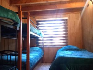 Postel nebo postele na pokoji v ubytování Mi Refugio del Sur