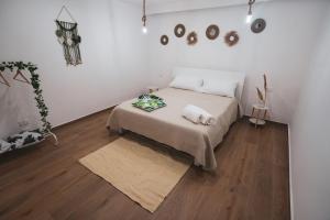 Postel nebo postele na pokoji v ubytování Macramè Room