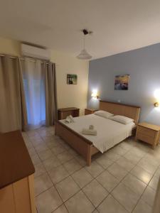 Postel nebo postele na pokoji v ubytování Villa Avra