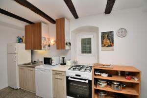 Kuchyň nebo kuchyňský kout v ubytování Apartment Gaspar