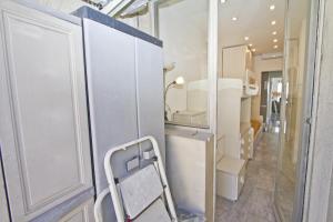 a bathroom with a mirror and a toilet in a room at Luxury Sea Front Condo Milord in Nice