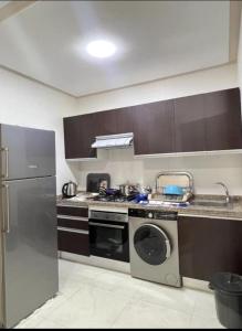 Kuchyň nebo kuchyňský kout v ubytování Apart Nador de Luxe 1