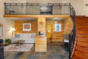 a living room with a loft with a couch at #21 The Silo in Gruene in New Braunfels