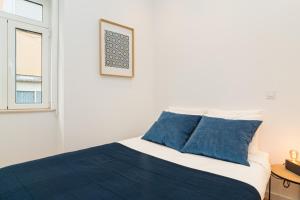 Krevet ili kreveti u jedinici u objektu Arroios Concept Apartments by Homing