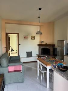 a living room with a couch and a table at Casa di Fausto - CityLife Apartment in Milan