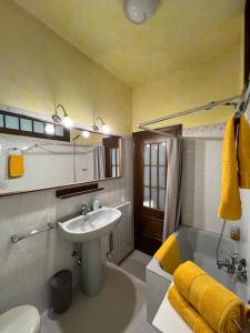a bathroom with a sink and a tub and a toilet at Casa di Fausto - CityLife Apartment in Milan