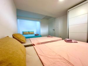a room with two beds and a room with at D&A Apartments in Ohrid