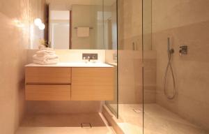 a bathroom with a sink and a shower at Boutique Stays - The Residence in Melbourne