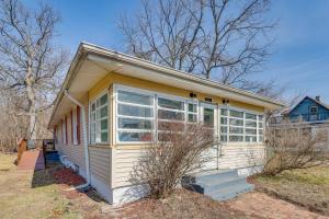 a tiny house with a lot of windows at Dog-Friendly Michigan City Home - 3 Mi to Beach! in Michigan City