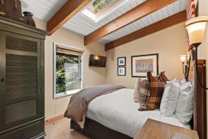 a bedroom with a bed and a window at Little Nell Condominiums Unit 11, Top Floor Condo with Mountain Views, 3 Blocks to Gondola in Aspen