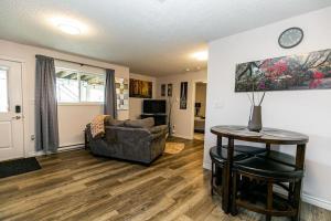 a living room with a couch and a table at Super wow view! in Victoria