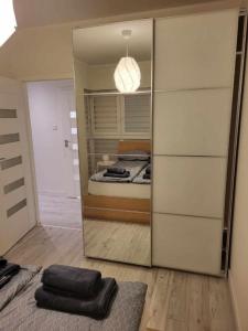 Posteľ alebo postele v izbe v ubytovaní Apartament Rzeczypospolitej