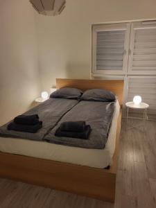 Posteľ alebo postele v izbe v ubytovaní Apartament Rzeczypospolitej