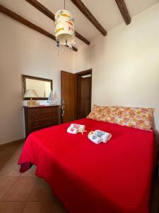 Letto o letti in una camera di Residenza sul Mare Baia Cornino