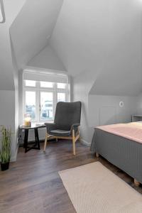 Ένα ή περισσότερα κρεβάτια σε δωμάτιο στο Charming apartment in Selfoss center