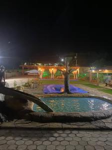 a water fountain with a tree in the middle at Casa de Maju in Morros