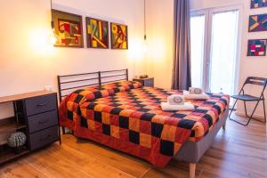 a bedroom with a bed with two towels on it at Nuovo Bilocale Prada a 2 passi & Duomo in 20 min in Milan