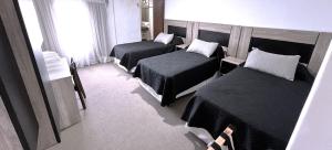 Postel nebo postele na pokoji v ubytování Hotel Plaza Formosa