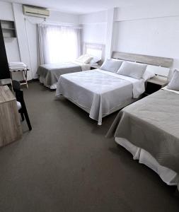 Cama ou camas em um quarto em Hotel Plaza Formosa