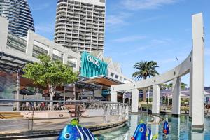 a shopping mall with a pool in the water with buildings at Oracle 2 1907 in Gold Coast