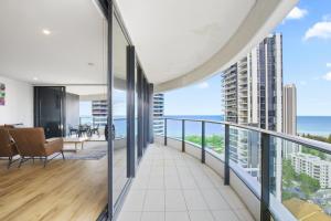 an apartment balcony with a view of the ocean at Oracle 2 1907 in Gold Coast
