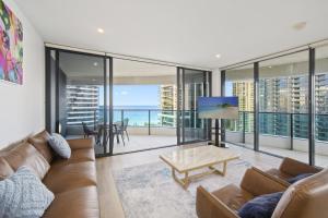 a living room with a couch and a table at Oracle 2 1907 in Gold Coast