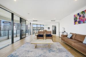 a living room with a couch and a table at Oracle 2 1907 in Gold Coast