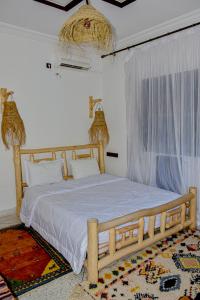 Ένα ή περισσότερα κρεβάτια σε δωμάτιο στο Hotel Safari Week end
