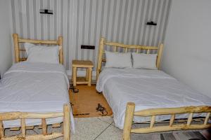 Ένα ή περισσότερα κρεβάτια σε δωμάτιο στο Hotel Safari Week end