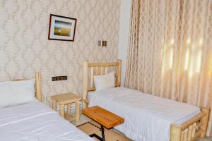 Ένα ή περισσότερα κρεβάτια σε δωμάτιο στο Hotel Safari Week end