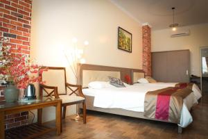 Säng eller sängar i ett rum på Anh Đức Hotel