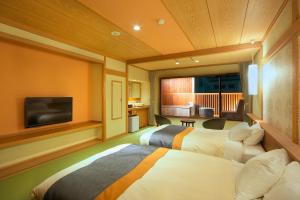 A bed or beds in a room at Umiusagi