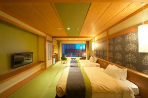 A bed or beds in a room at Umiusagi