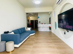 TV i/ili multimedijalni sistem u objektu Penghu Roundabout Guesthouse