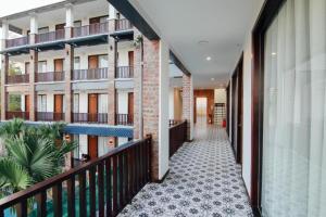 a corridor of an apartment building with a balcony at Sea Angel HOTEL Tuần Châu Hạ Long in Ha Long
