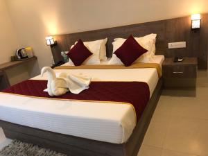 Krevet ili kreveti u jedinici u okviru objekta Hotel Rameswaram KNP Nest