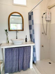 a bathroom with a sink and a shower at Ban Narai River Guesthouse in Chiang Mai +44 photos