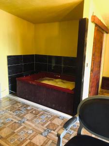 a room with a tub in the corner of a room at Happy Hobbit ,2 room jakuzi, Lake view, fireplace in Sapanca 1 in Sapanca