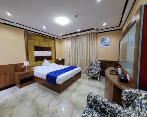 Postel nebo postele na pokoji v ubytování Camphor Hotel