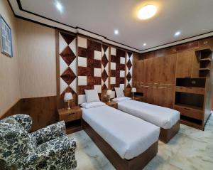 Postel nebo postele na pokoji v ubytování Camphor Hotel