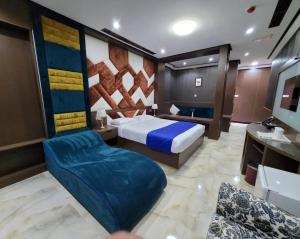 Postel nebo postele na pokoji v ubytování Camphor Hotel