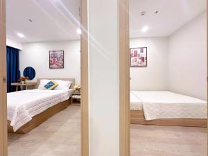 - une chambre avec 2 lits dans l'établissement The Sóng Vũng Tàu Xinh, à Vung Tau