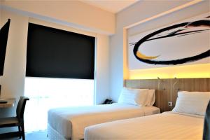 Giường trong phòng chung tại Enso Hotel