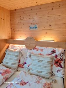a room with a bed with pillows on it at Studio "Children of Powdersnow" in Mühlbach am Hochkönig