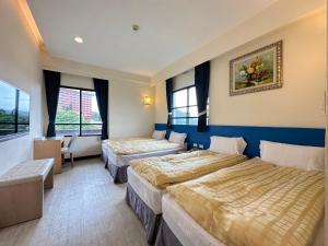 Postel nebo postele na pokoji v ubytování CHIENTAN Youth Hotel + 37 fotografií