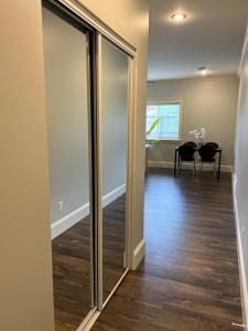 a hallway with sliding glass doors in a home at Spacious !!! NEWER HOME 2 bedrooms Entire suite !! Near Airport !!!! in Abbotsford